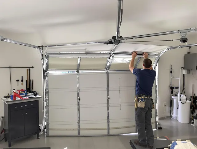 Montebello Garage Door Repair specialist performing precise section replacement on Montebello garage door